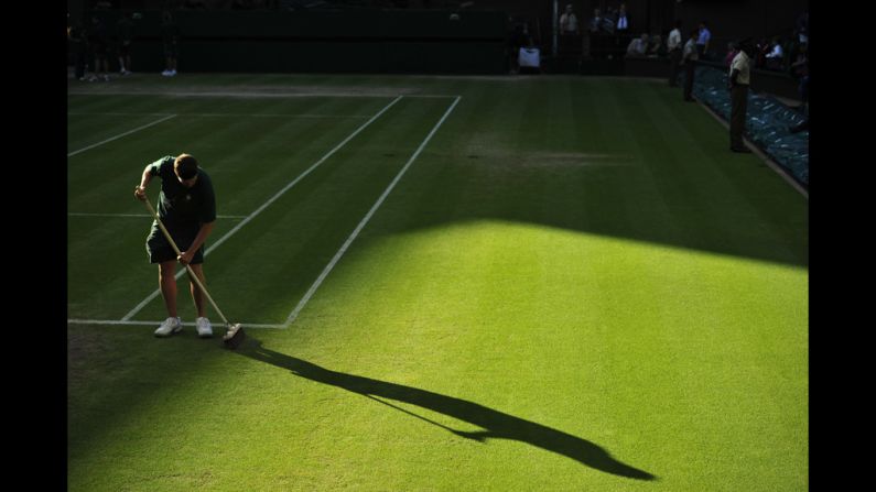 A groundskeeper prepares the grass on Centre Court on Friday.