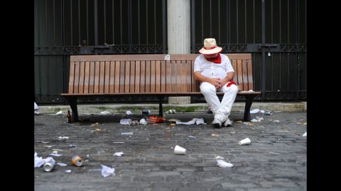 A runner rests on a bench on the first day of the festival.