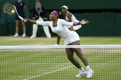 Serena Williams hits a volley during women's doubles final.