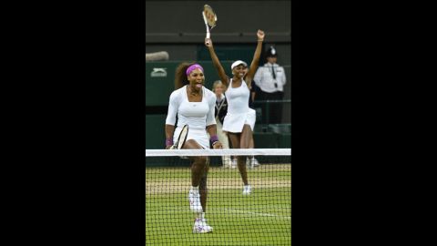 Sisters Serena and Venus Williams of the United States celebrate following their win against Czech Republic's Andrea Hlavackova and Lucie Hradecka in the women's doubles final on Saturday.