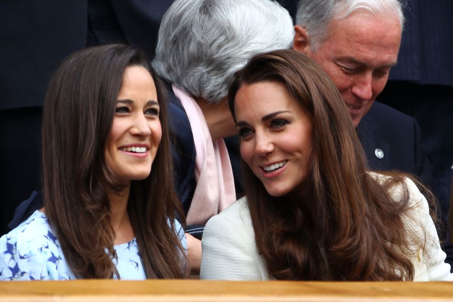 Pippa Middleton, left, and her sister, Catherine, Duchess of Cambridge, sit in the royal box during the match between Federer and Murray on Sunday.