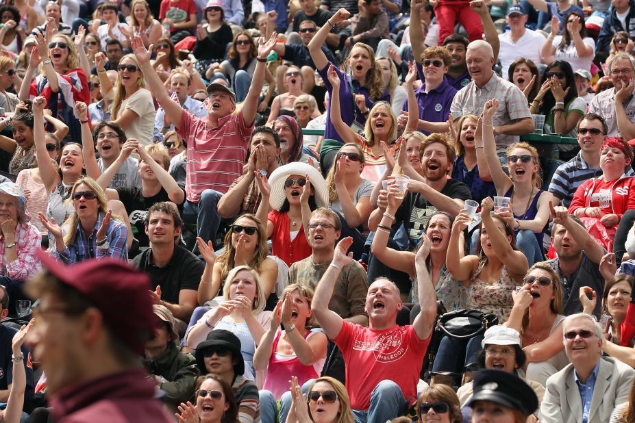 Fans cheer during the first set of the championship match Sunday.