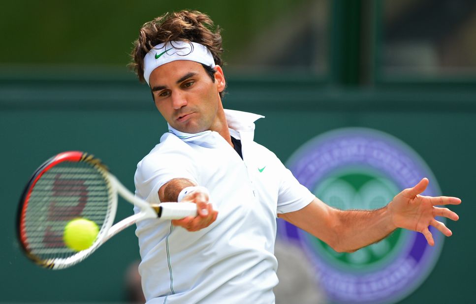 Federer returns a forehand to Murray during the first set.