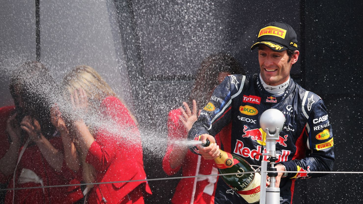 Red Bull's Australian driver Mark Webber celebrates after winning the British Grand Prix at Silverstone