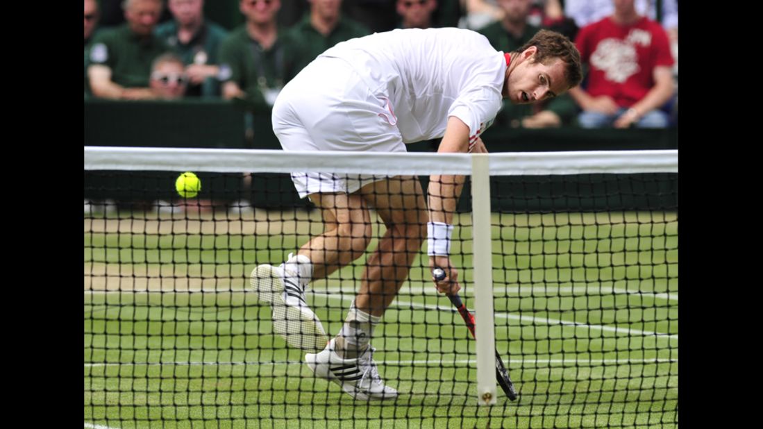 Murray reaches for a short shot by Federer on Sunday.
