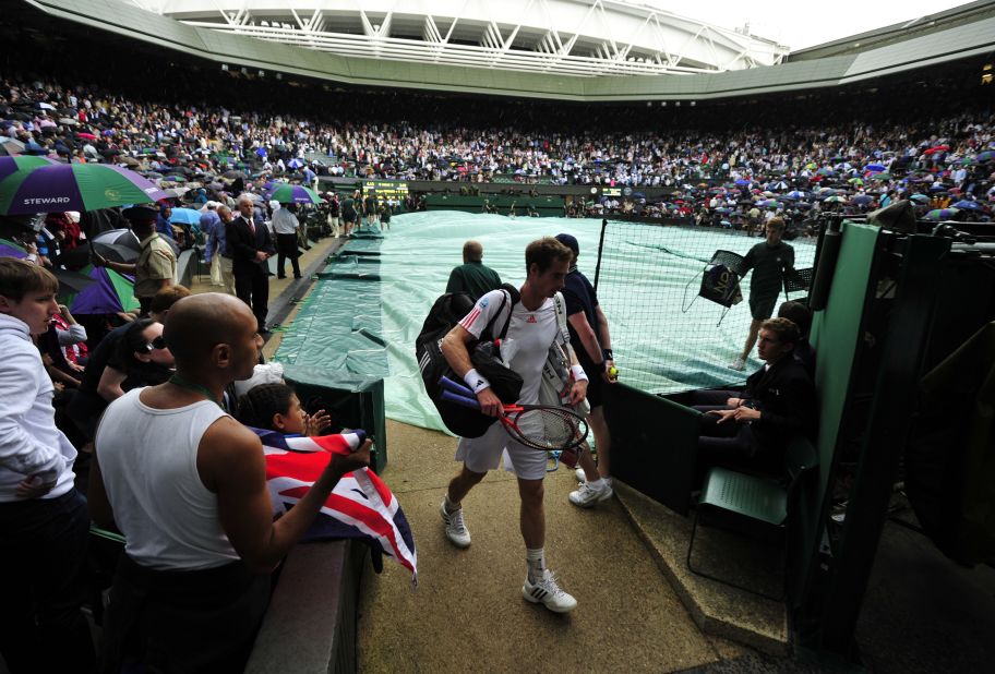 Murray leaves the court during a rain delay in the second set Sunday. Murray was trying to become the first British man to win the title since Fred Perry in 1936.