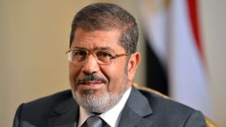 Egyptian President Mohamed Morsy looks on as he meets with US deputy secretary of State William Burns (not seen) in Cairo on July 8, 2012. 