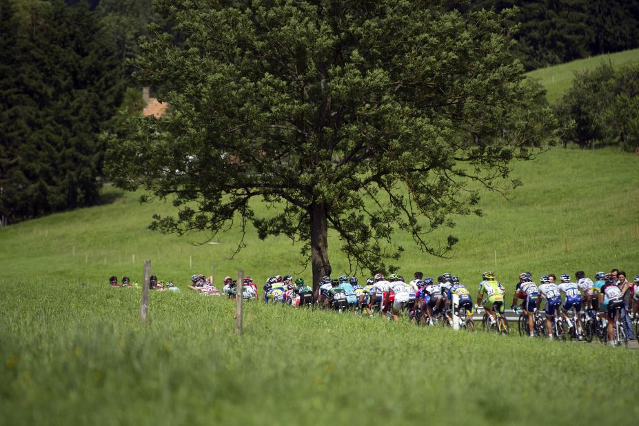 The peloton makes its way through the narrow roads of the French countryside on the way to the stage finish in Porrentruy, Switzerland, on Sunday.