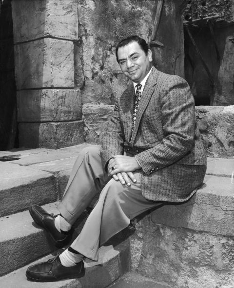 Borgnine sits outdoors during the filming of Michael Curtiz's "The Best Things in Life Are Free" in 1956.