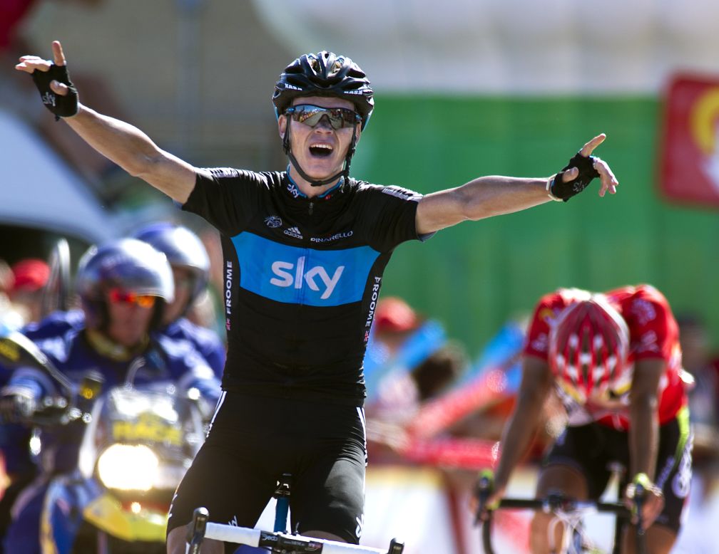 Great Britain's Christopher Froome celebrates as he crosses the Stage 7 finish line on Saturday to take the win.
