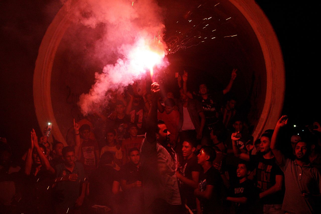 Libyans light up a flare Saturday, July 7, in Benghazi as they celebrate the country's first free national election in decades after the ouster of dictator Moammar Gadhafi.