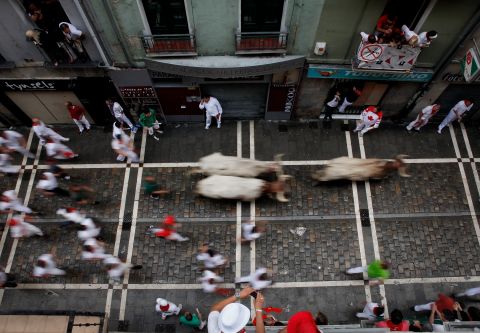 Participants run along Estafeta Street in Pamplona on Sunday, July 8.