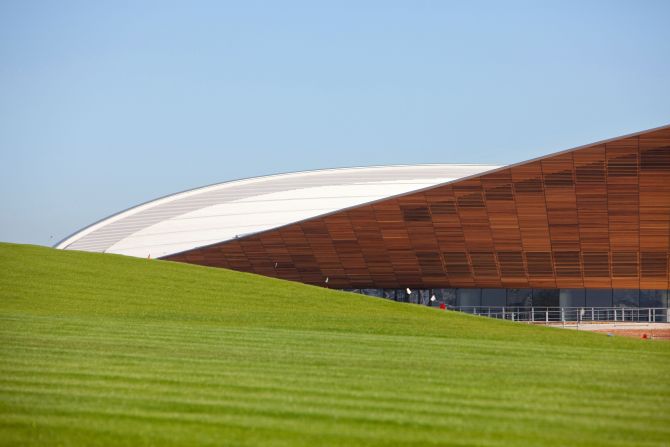 The venues, like the velodrome pictured here in the background, blend into the landscaped parkland creating a number of striking vistas.   