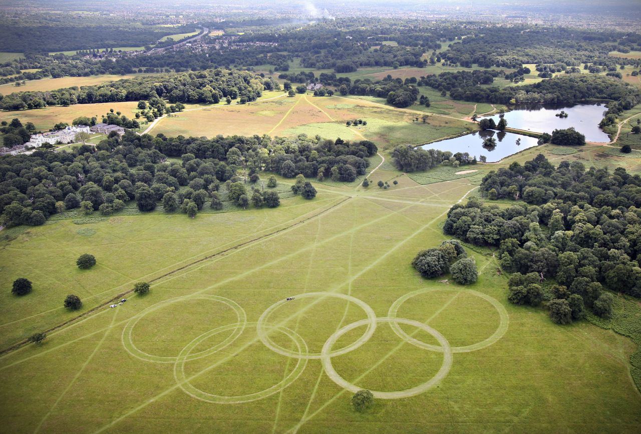 With just days to go until the opening ceremony, organizers have cut Olympic rings into the grass in Richmond Park, south-west London, further promoting the green ambitions of the Games. David Stubbs, head of sustainability for London 2012 said: "If you can put sustainability at the heart of a project which is the largest logistical exercise in peace time ... then you can do it anywhere."