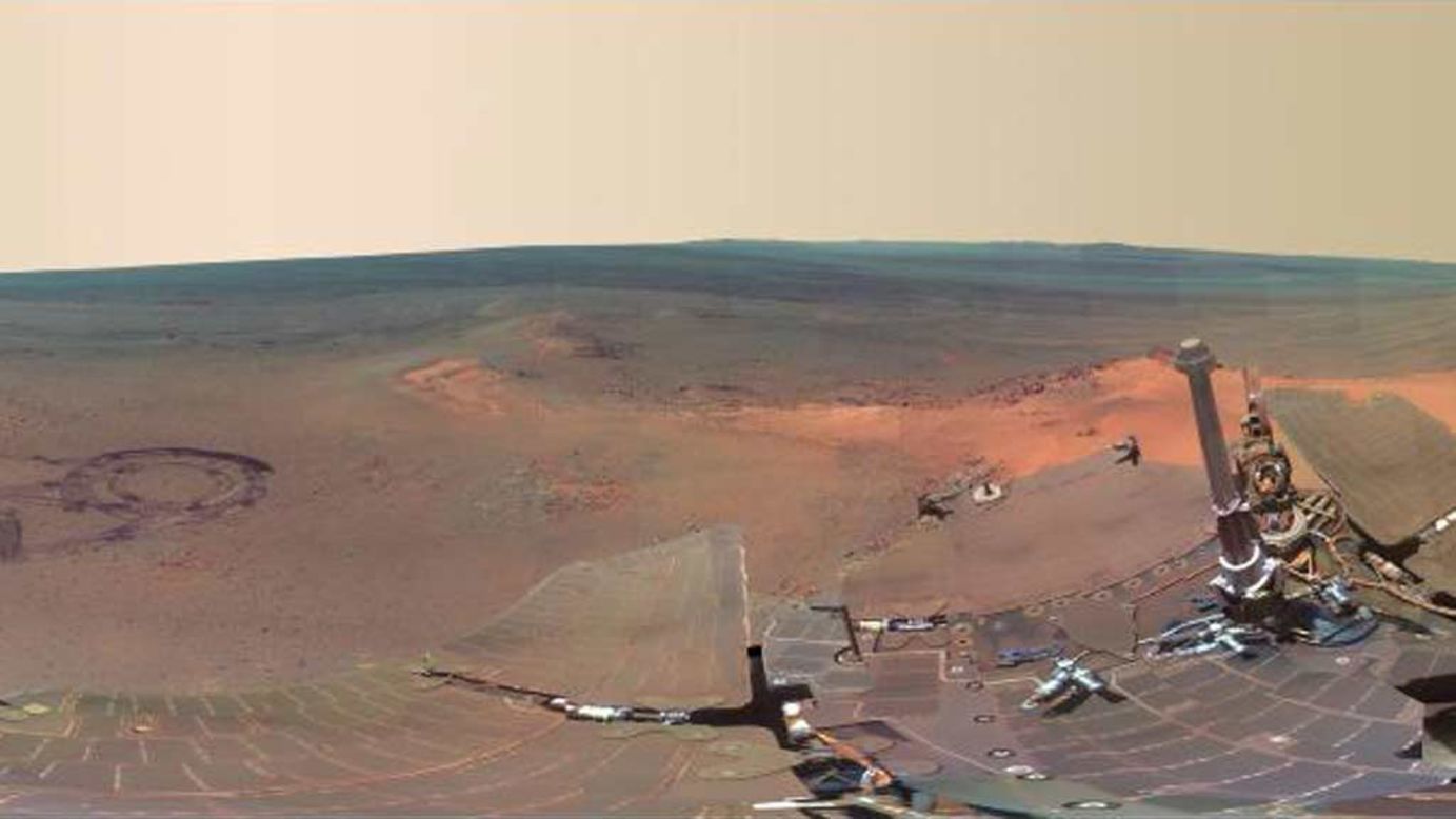 The 360-degree image is made up of 817 separate shots taken by Opportunity, which has been exploring Mars for more than eight years. The rover's own solar arrays can be seen in the foreground, with the martian landscape visible in the background.