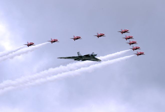 The RAF Red Arrows take to the skies with the last remaining flying Vulcan for a flypast to open the week's aviation festivities.