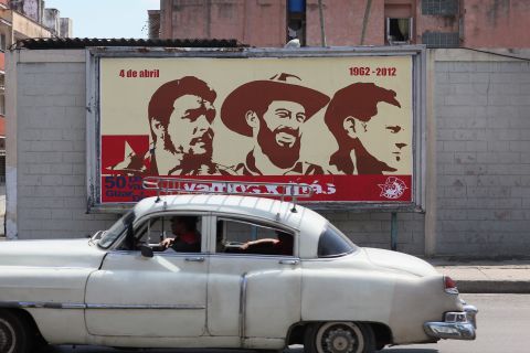 Some of the Castro regime's battle to control perceptions in Cuba is played out on billboards across the capital Havana. Here, a billboard shown in 2012 celebrates (L-R) Che Guevara, Camilo Cienfuegos and Julio Mella, three of the country's revolutionary heroes.
