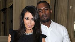 Kim Kardashian and Kanye West attend the Valentino Haute-Couture show as part of Paris Fashion Week Fall / Winter 2012/13 at Hotel Salomon de Rothschild on July 4, 2012 in Paris, France. 