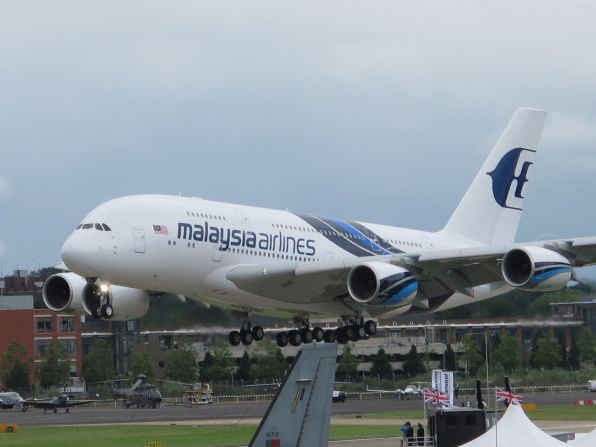 The Airbus 380 in Malaysia Airlines colors lands after a spectacular aerial performance of sweeping maneuvers at the Farnborough Airshow on Monday.