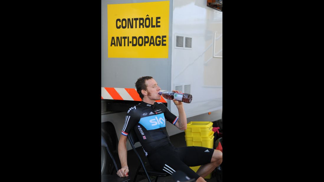 Stage winner Bradley Wiggins drinks before entering the anti-doping control bus at the end of the 41.5-kilometer Stage 9 individual time trial.
