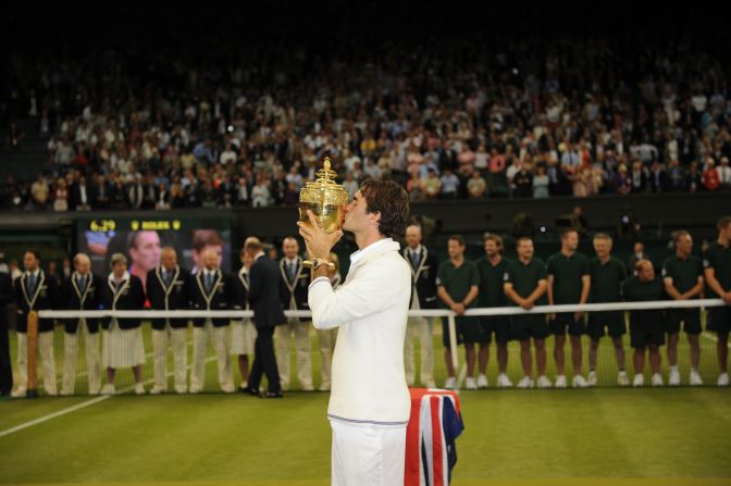 Roger Federer celebrates a record-equaling seventh Wimbledon triumph, a 17th grand slam title and a return to the top of the world rankings. 