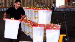 A High Election Commission worker collects ballot boxes from different polling stations to prepare for the final counting at Maatiga airport in Tripoli on July 8, 2012.