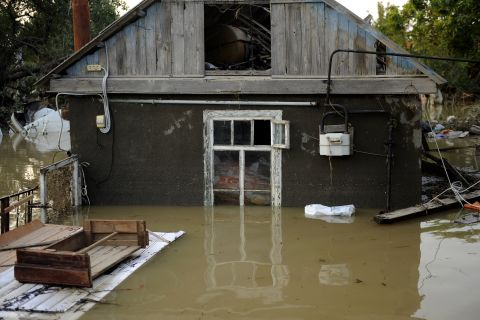 A home in the southern Russian town of Krymsk sits amid floodwaters that have yet to recede since setting in Friday.