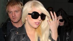 Lady Gaga flips off the crowd while wearing see thru leggings at LAX. July 9, 2012 X17online.com
