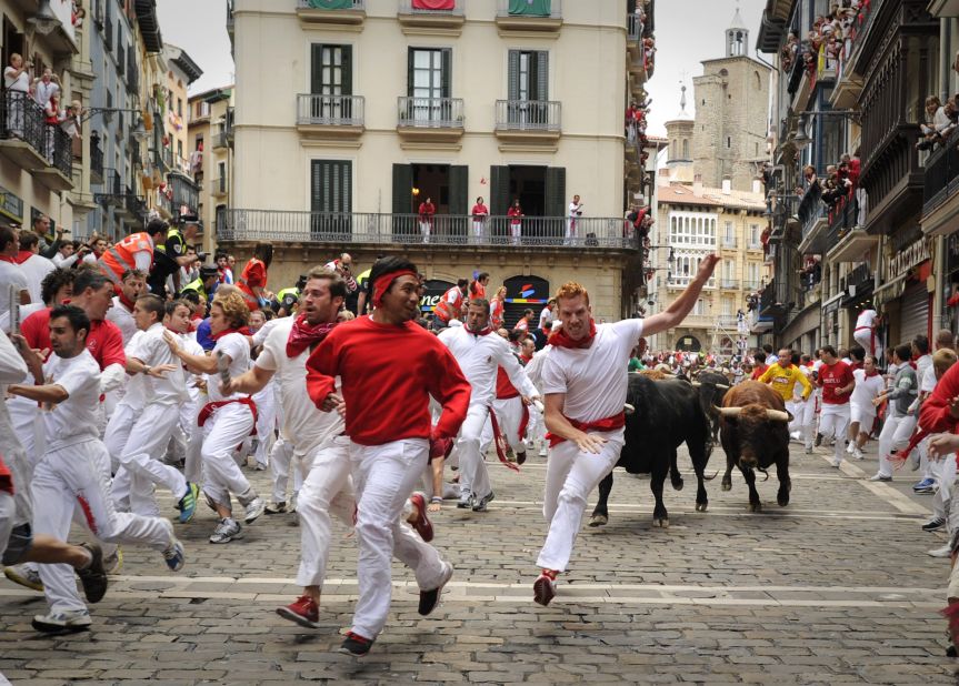 Participants run in front of El Pilar bulls on the fourth day of the San Fermin festival on Tuesday, July 10.