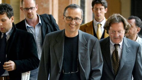 Italian sports doctor Michele Ferrari, center, leaves a tribunal in Bologna, Italy, in 2004. 
