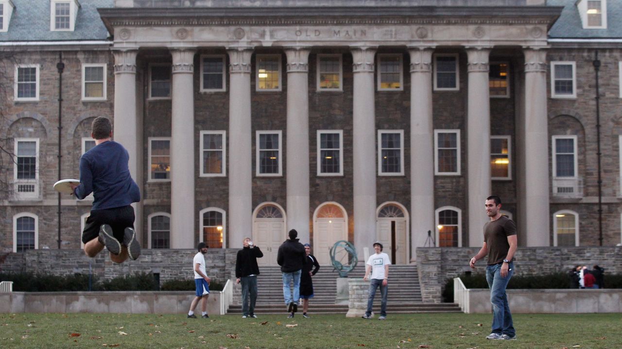 In the wake of the Jerry Sandusky scandal, Penn State University students play frisbee on campus in November.