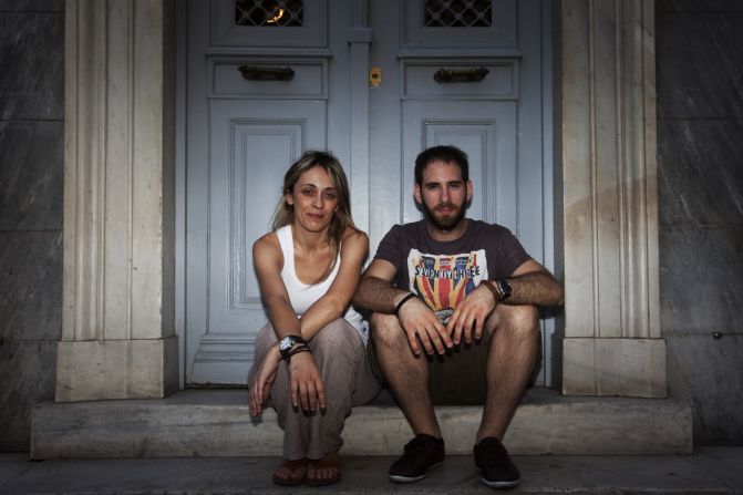 Maria Papanagiotaki and Aristotle Skalizos, part of Greece's young professional class. They have been dating for more than two years but have different views on whether to stay in Greece or leave for opportunities elsewhere.