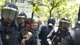 Police arrest a woman during clashes following a miners' demonstration in Madrid, on July 11, 2012.