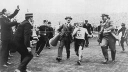 On the verge of collapse, marathon runner Dorando Pietri is helped across the finish line at the 1908 London Olympics. The Italian was subsequently disqualified and the title given to John Hayes of the U.S.