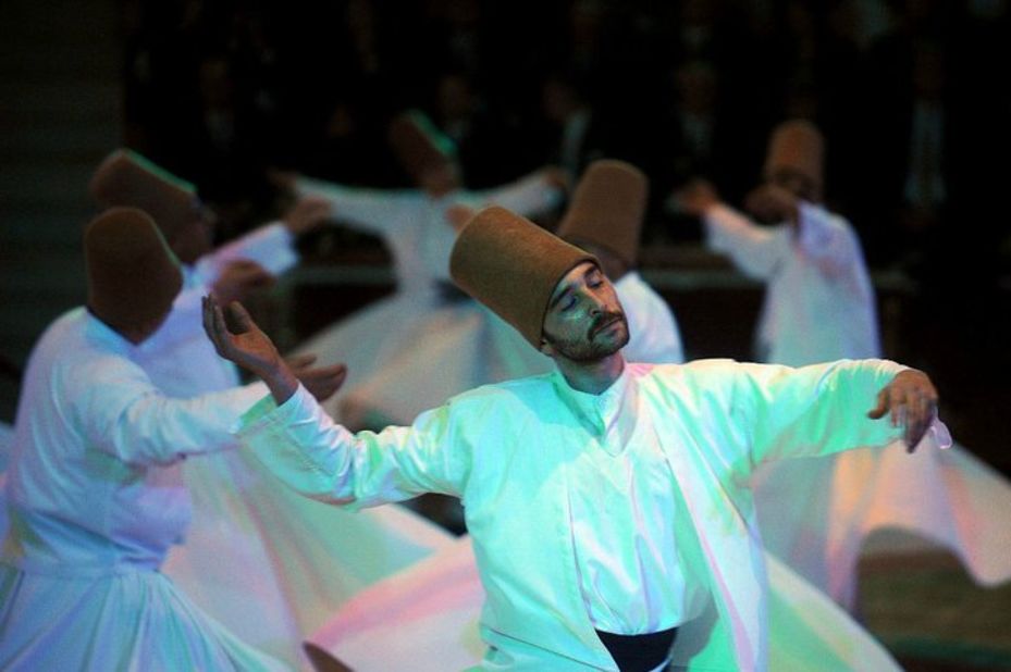 A dervish whirls in religious ecstasy in the Turkish city of Konya, where the Sufi mystic Rumi is buried. "Muslim for a Month" tours visit the tomb and observe the dervishes.