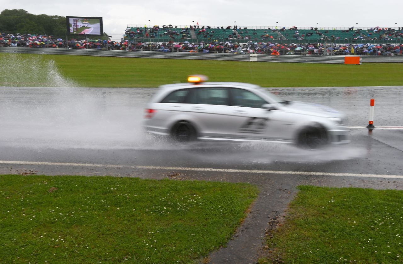 Formula One's British Grand Prix eventually began under clear skies but heavy rain prior to the race forced organizers to ask those with cars not to attend Saturday's qualifying session after camping areas and car parks became waterlogged.