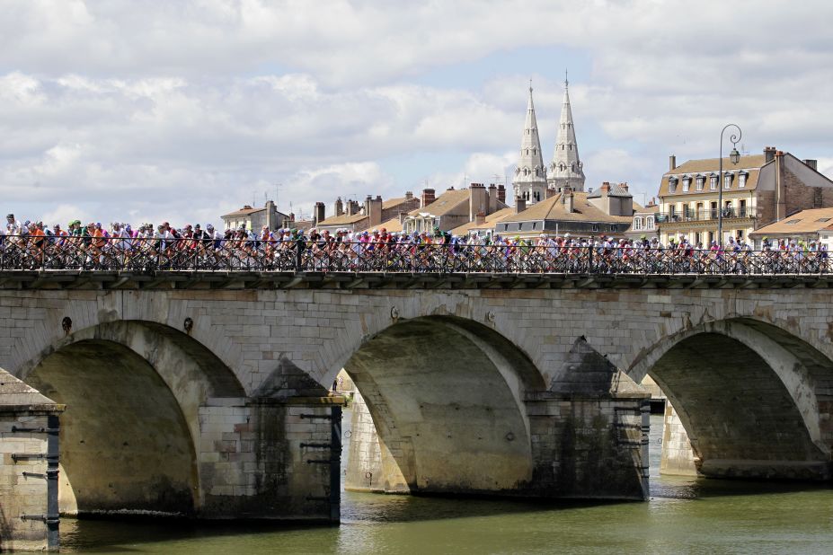 The cyclists cross a bridge in Macon at the beginning of Wednesday's events.