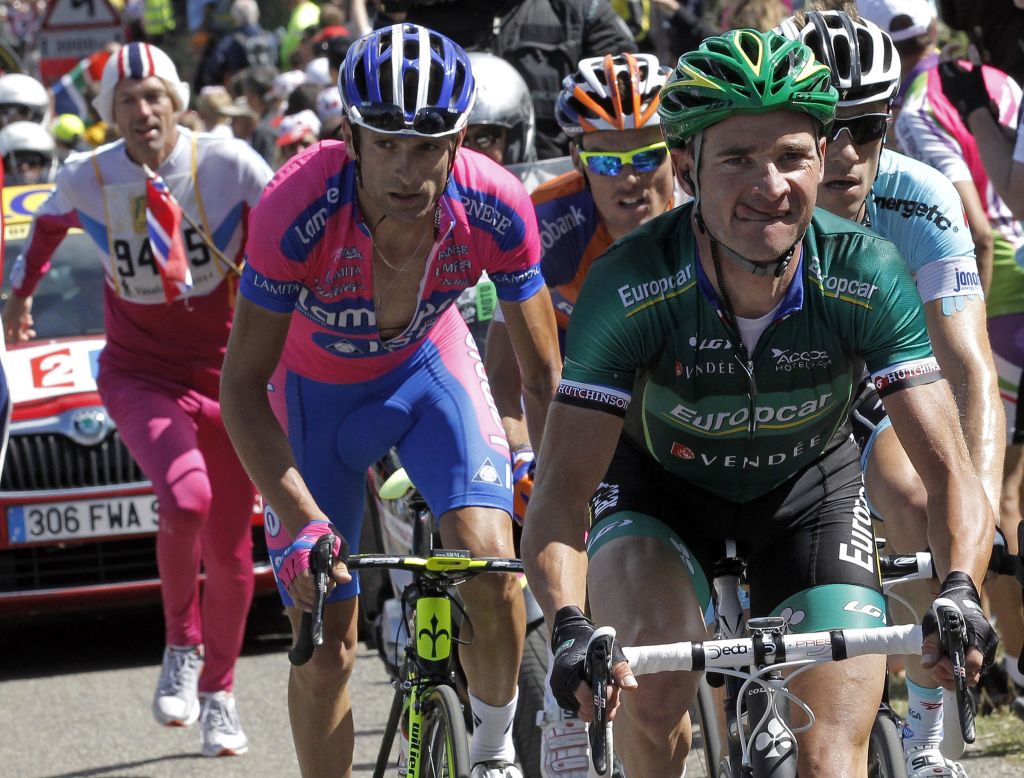 Thomas Voeckler of France, right, leads a breakaway group of four riders through the mountains.
