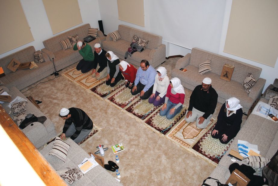 Tour participants are taught to pray in a private home in Istanbul.