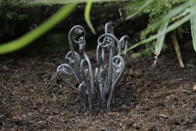 Jo Coupe's casts plants in lead, creating deathly-looking objects. "Lead is not an environment-friendly material, it's visually deadly," Coupe says. "It's a metaphor for life and death."