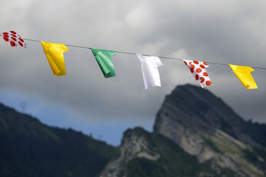Representations of Tour de France leaders' jerseys hang along the road during Thursday's race.