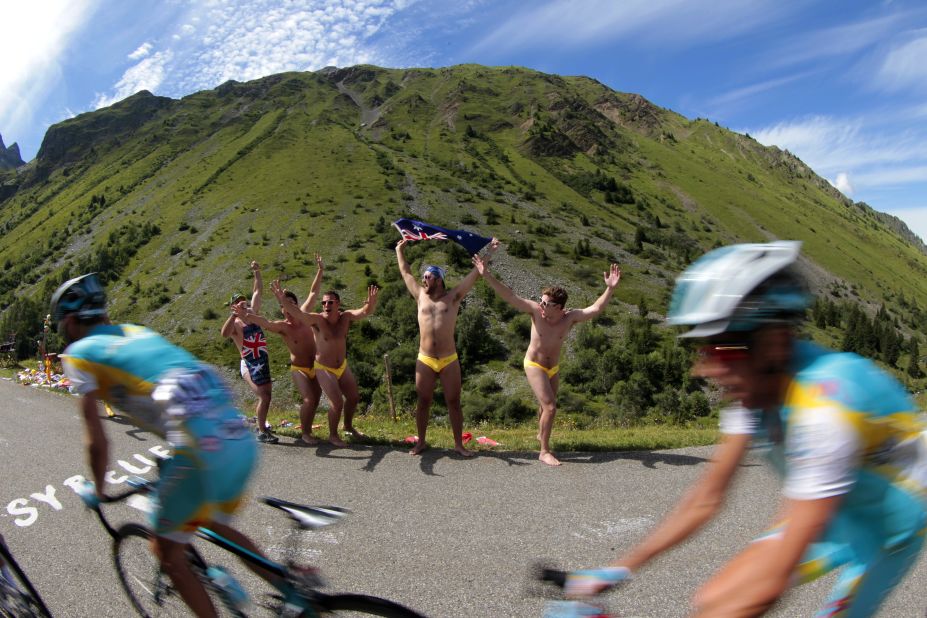 Australian fans cheer riders as they pass by during Thursday's race, the first full stage in the Alps.