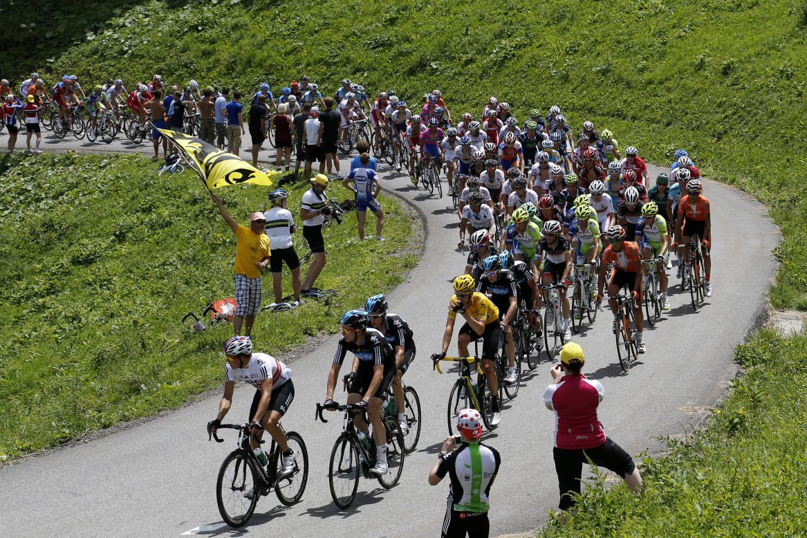 Riders make their way through the French Alps on Thursday during the 11th stage of the Tour de France, which covers 91 miles starting in Albertville and finishes in La Toussuire-Les Sybelles, France. 