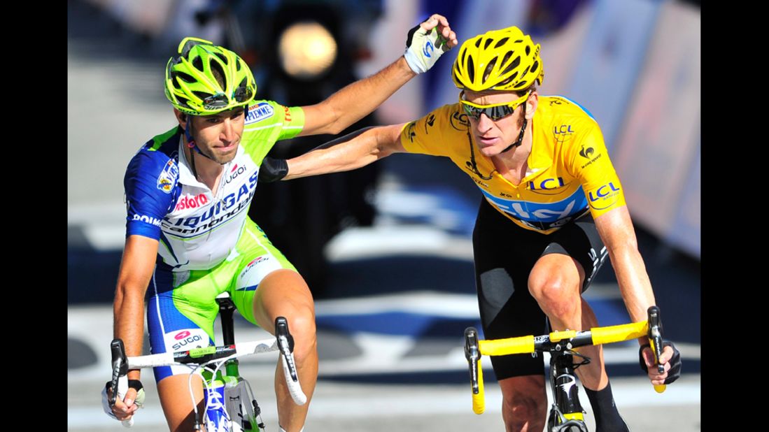 Vincenzo Nibali of Italy, left, and Bradley Wiggins of Britain celebrate at the conclusion of Thursday's race.