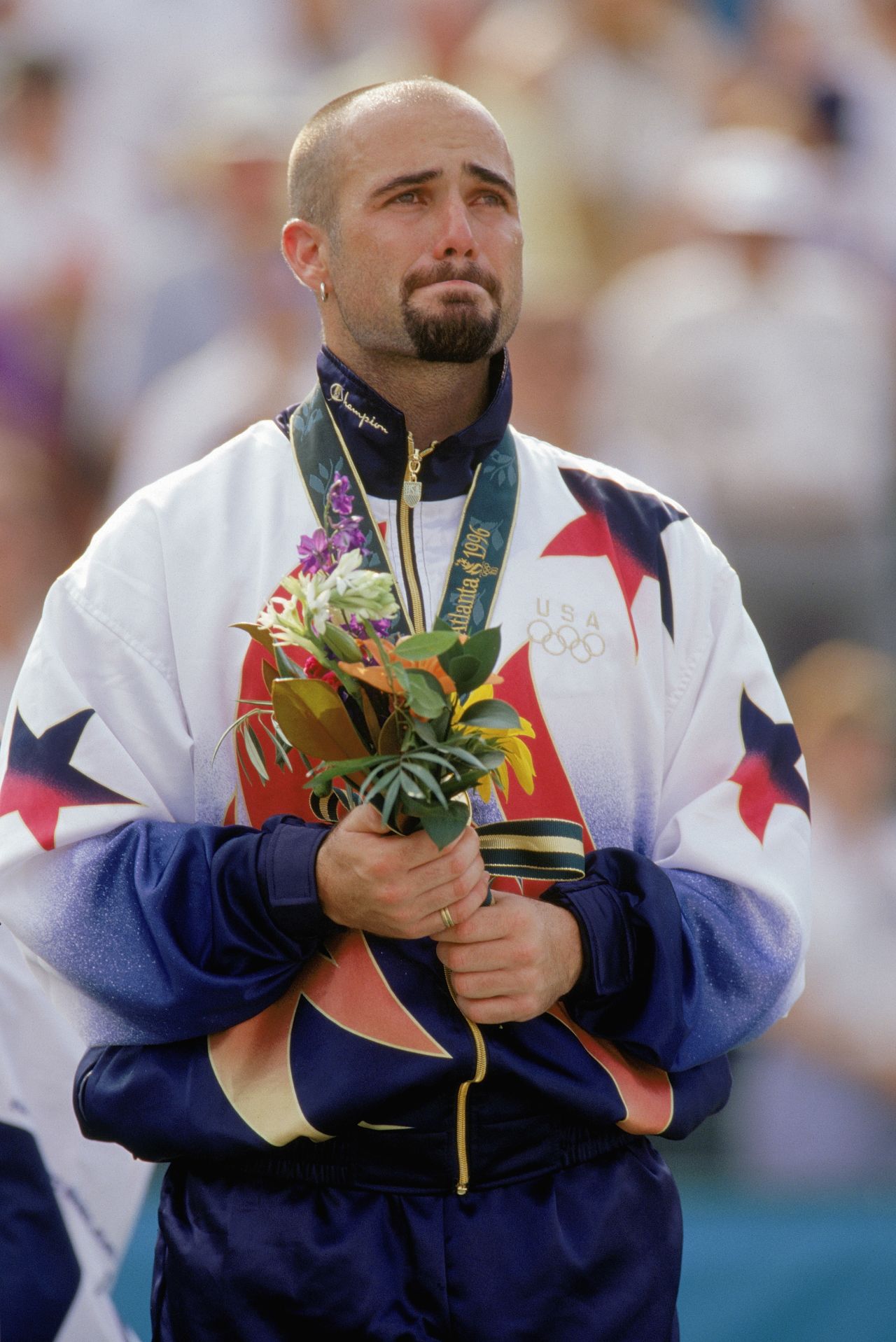 Agassi won Olympic gold in 1996 at Atlanta, and showed just how much it meant to him at the victory ceremony.
