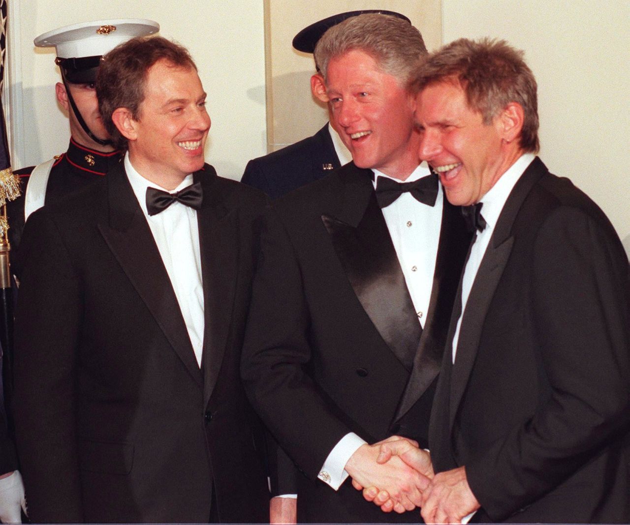 Ford is greeted by President Bill Clinton and British Prime Minister Tony Blair during a state dinner at the White House in 2005.