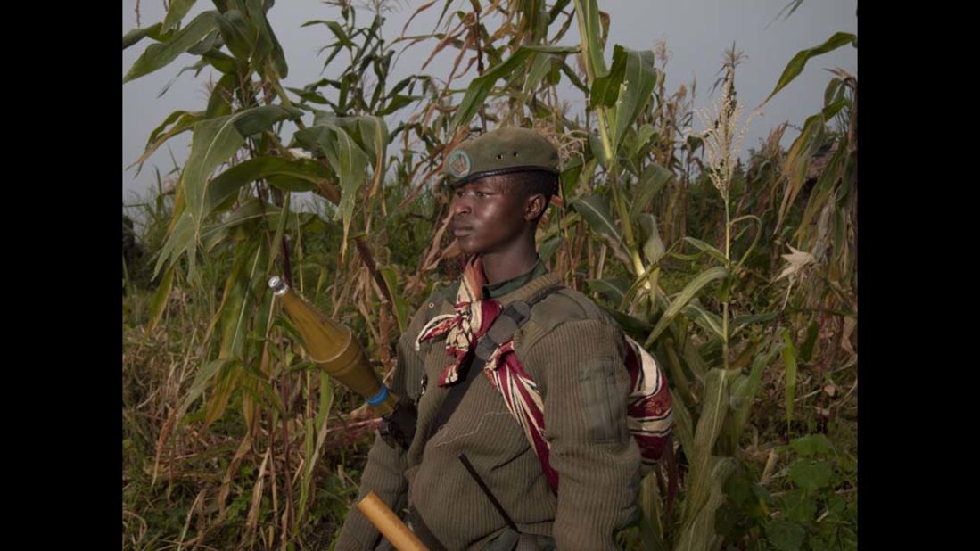 An M23 rebel soldier poses at a FARDC base in Rumangabo on July 9. Congolese M23 mutineers were pulled out of the key eastern town of Rutshuru, near the borders with Uganda and Rwanda a day after seizing it. 