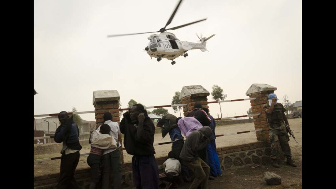 A UN helicopter pulls out of the town of Bunagana on July 7. Bunagana was claimed by renegade soldiers of the Democratic Republic of Congo on July 6, after fighting regular Congolese armed forces, police and the mutineers said. 