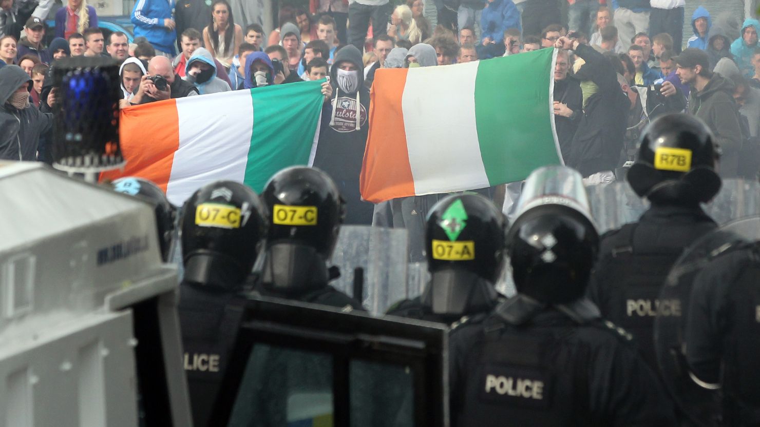Protesters clash with police after a march in North Belfast, in Northern Ireland, on July 12, 2012.