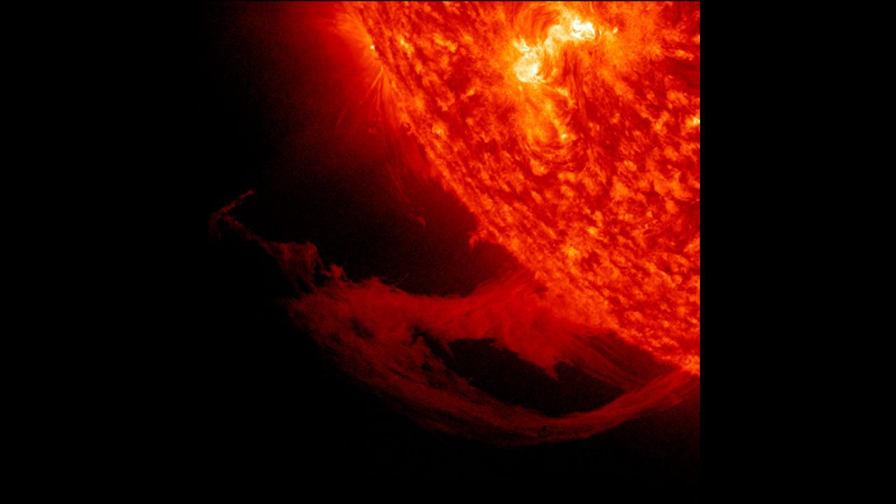 This close-up view of a prominence reveals magnetic forces at work as they pull plasma strands this way and that before it gradually breaks away from the sun over November 14-15, 2011.
